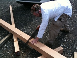 Hand Saw crosscuts a 6x6 Douglas Fir timber for a workbench